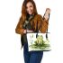 Smiling frog sitting on a pond leaather tote bag