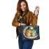 Two cute owls in love hugging each other on the moon leather tote bag