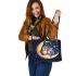 Two owls in love sitting on the crescent moon leather tote bag