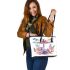 Watercolor dragonfly surrounded in the style of flowers leather tote bag