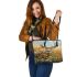 Whitetail deer buck standing in tall grass with daisies leather totee bag