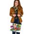 Colorful cartoon tree frog with lily flower leaather tote bag