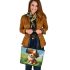 Cute brown and white puppy is sitting on the grass leather tote bag