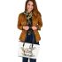 Cute cartoon rabbit holding a carrot leather tote bag