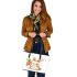 Cute cartoon rabbit holding a carrot leather tote bag