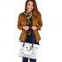 Happy corgi with butterfly on its nose in the garden leather tote bag