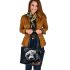 Panda with black and white fur and colorful floral leather tote bag