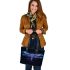 With a neon blue and purple dragonfly leather tote bag