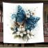 Blue butterfly with white flowers around blanket