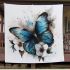 Blue butterfly with white flowers around blanket