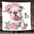 Cute and happy english bulldog puppy with pink roses blanket