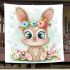 Cute cartoon bunny with big eyes sitting on the flowers blanket