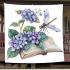 Cute dragonfly perched on an open book blanket
