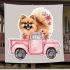 Cute pomeranian dog in a pink truck with flowers blanket