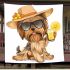 Cute yorkshire terrier in a summer hat and sunglasses holding blanket