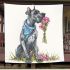 Great dane with a blue bandana sitting holding pink flowers blanket