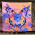 Orange butterfly surrounded by colorful spring flowers blanket