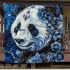 Panda adorned with white and blue diamonds blanket