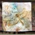 Whimsical watercolor dragonfly perched on an open book blanket