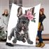 Adorable grey french bulldog puppy wearing pink roses blanket