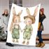 Adorable two bunnies holding hands dressed in green blanket