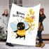 Bee holding yellow and orange wildflowers blanket