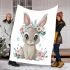 Cute cartoon bunny with big eyes sitting on the flowers blanket