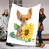 Cute chihuahua puppy with big eyes sitting next to a sunflower blanket