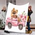 Cute pomeranian dog in a pink truck with flowers blanket