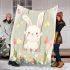 Cute white rabbit sitting on the swing blanket