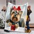 Cute yorkshire terrier inside a large gift box blanket