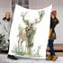 Deer with large antlers stands in the forest blanket