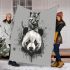 White panda head with kitten on top blanket