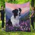 Black and white border collie in the foreground blanket