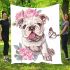 Cute and happy english bulldog puppy with pink roses blanket