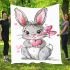 Cute cartoon bunny with a pink bow holding a heart blanket