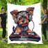 Cute yorkshire terrier dog wearing headphones blanket