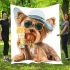 Cute yorkshire terrier in a summer hat and sunglasses holding blanket