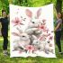 Family of three white rabbits with pink flowers blanket