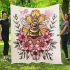 Queen bee sitting on top of honeycomb blanket