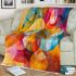 Abstract painting of vibrant colors and shapes blanket