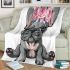 Adorable grey french bulldog puppy wearing pink roses blanket