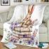 Baby rabbit sitting on top of books surrounded by flowers blanket