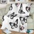 Black and white butterfly pattern with pink accents blanket