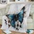 Blue butterfly with white flowers around blanket