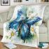 Blue butterfly with white flowers around blanket