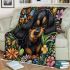 Cute black and tan dachshund among spring flowers with butterflies blanket