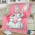 Cute cartoon bunny with a pink bow holding a heart blanket