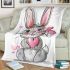 Cute cartoon bunny with a pink bow holding a heart blanket