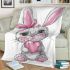 Cute cartoon bunny with a pink bow holding a heart blanket